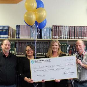 NORMAND L’HEUREUX, president of Boothbay Region Education Association, left, with Lois Kilby-Chesley, Maine Education Association’s president, and Amy Grosso of California Casualty, present a $1,500 grant to high school tennis coach and English teacher Mark Gorey. SUZI THAYER/Boothbay Register