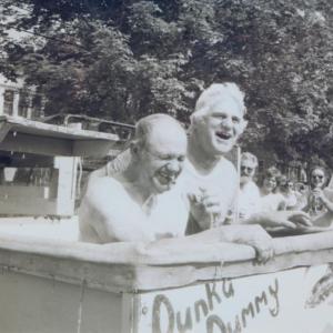 Elbridge Giles and Chetley Rittall enjoy a dunk in the tank at one of Boothbay’s celebrations on the Common. File photo