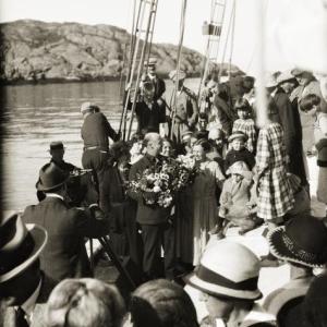 Bowdoin Captain MacMillan being presented with flowers off Monhegan Island, circa 1924. Courtesy of Penobscot Marine Museum