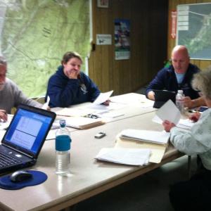 Selectmen Jack Sarmanian, left, Jessica Chubbuck, Stuart Smith and Town Clerk/Treasurer Claudia Coffin deliberate over a new tax program at Monday night’s seletmen’s meeting. SUZI THAYER/Boothbay Register