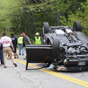 Emergency responders work at the scene of the accident on Route 27 in Southport Friday morning. KEVIN BURNHAM/Boothbay Register