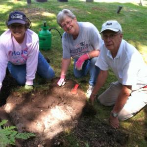 Working in a Southport graveyard are, from left, Becky Weeks Singer, Lois Rand Weeks and Charlie Weeks. Courtesy of Jim Singer