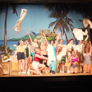 Devin Dukes, center, as Nellie Forbush of Little Rock, Arkansas, attempting to 'wash that man right outta her hair.' LISA KRISTOFF/Boothbay Register