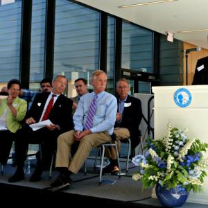 Dr. Graham Shimmield welcomes the audience. Counter-clockwise from left front, Mary Bigelow, Robert Healing, Sen. Angus King, David Coit, Jim Chaousis and Alex Vermont. KATRINA CLARK/Boothbay Register