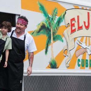 An out of work Chef (Jon Favreau) right, buys a Cuban food truck and takes a road trip with his son (EmJay Anthony) in a scene from “Chef” now playing at The Harbor Theatre. Courtesy of The Harbor Theatre