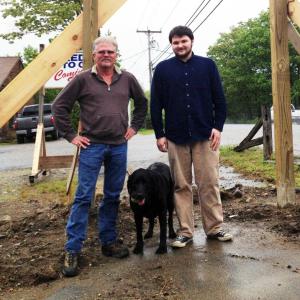 Doug Miller, left, and his son Kyle stand outside their new business, Boothbay Region Auto Sales, with their office mate, Brady. SARAH MORLEY/Boothbay Register