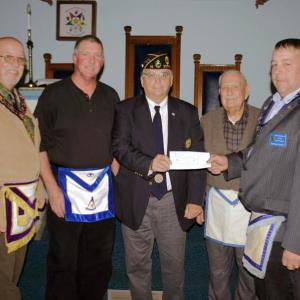 Bay View Masonic Lodge presents the $1,000 donation to purchase flags at its June meeting. Present were District Deputy Charles Billings representing the Maine Masonic Charitable Foundation; Linc Sample of Bay View Lodge who sought funding for flags; Robert Raudenbush, Past Commander of the Charles E. Sherman Jr. Post who received the donation; Harry Pinkham, an active Mason and member of the American Legion; and Michael Alley, presiding officer of Bay View Masonic Lodge. Courtesy of Thomas Pulkkinen