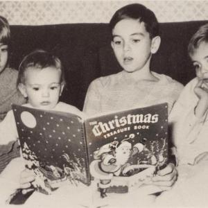 Christmas 1951. Ann Kelley, left, and her siblings enjoy a Christmas book. Courtesy of Ann Kelley