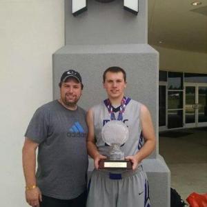 Edgecomb resident Gregory Sprague, left, with son Brandon Sprague and the championship trophy the teen and his team won on July 20 in Tavares, Fla., outside Orlando. Courtesy of Anita Sprague Gregory Sprague