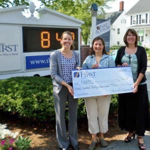 Gathered for a check presentation at the Damariscotta office are, from left, Amy York, Senior Commercial Loan Assistant; Heather Burt, FARMS; and Sherry Smith, AVP Branch Manager. Courtesy of The First