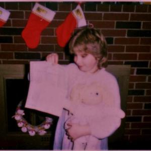 Melinda Nunan, now Melinda Fuller, holds up the adoption paper for her Cabbage Patch Doll at a 1980s Nunan family Christmas at what is now the Wiscasset Newspaper office, on Wiscasset’s Gardiner Road. Courtesy of Melinda Fuller Melinda Nunan, Melinda Fuller, Wiscasset Newspaper office