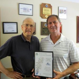 SVCA board president John Atwood, left, presents Robert Clifford of Colby & Gale a certificate of appreciation for its support of SVCA over the last 10 years. Courtesy of Kristin Pennock
