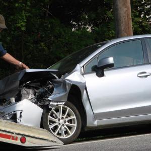 Bob Blagden of Blagden’s Wrecker Service in Wiscasset prepares to load a Subaru onto a flatbed August 1. Authorities said it was involved in a rear-end collision on Route 27 in Edgecomb. SUSAN JOHNS/Wiscasset Newspaper Bob Blagden