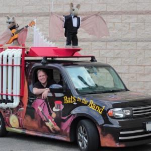 Brian Lies in his brand-new Batwagon celebrating his newest bat book, “Bats in the Band.” Courtesy of Rachel Wasdyke