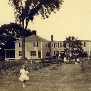This is a circa 1930 exterior shot of the Kenniston house with members of the Teel family, the owners from 1925 to 1956. Courtesy of Boothbay Region Historical Society.