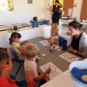 ASSISTANT TEACHER Lara Mann, right, oversees an art class at the new Harbor Montessori School. SUZI THAYER/Boothbay Register