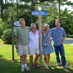 New sign. From left, Robert Hahn, Caroline Andrews, Kit Andrews and Mike Hahn gather around the new road sign at McKown Point honoring their ancestors. Courtesy of Stephen Rubicam