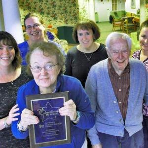 St. Andrews Village Assisted Living Resident Barbara Pond holds the “Excellence in Action” award that St. Andrews Village Assisted Living recently received for scoring in the top 10 percent of their peers in resident satisfaction. Next to Barbara is Village resident Alan Tindal. In the second row, left to right: Elizabeth Barter, RN, Clinical Nursing Manager, Melanie Hibbard, CNA, CRMA, Cathy Rayle, RN, Director of Nursing at the Gregory Wing and Bridy Lewis, CNA, CRMA. Courtesy of LincolnHealth