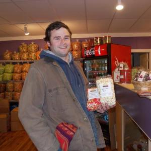 John Miller buys popcorn to send to his dad and two sisters in New York. KATRINA CLARK/Boothbay Register
