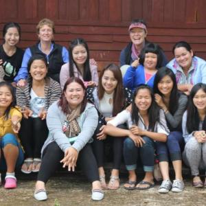 On a recent visit, the Friends of Thai Daughters family reunites in Doi Luang, the small village in Northern Thailand where Friends of Thai Daughters was “born.” Courtesy of Friends of Thai Daughters