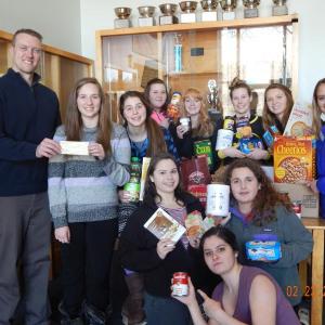 The Boothbay Region High School Interact Club donated a check for $500, and a lot of food items, to go towards BRHS’s WGME School Spirit Challenge. The challenge goes until Feb. 27, when it will culminate in an all-school rally starting at 6 a.m. Students will be wearing blue and gold to show their school pride. Courtesy of Debbie Graves