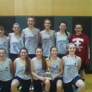 The Boothbay Region YMCA seventh and eighth grade girls travel basketball team holds the championship trophy at the Spruce Mountain tournament on Sunday, Feb. 8. Pictured from left are, front row: Katie Larson, Maddy Faulkingham, Chloe Arsenault, Maisy O’Brien, Josey Smith; back row: Ashley Abbott, Maggie Larson, Faith Blethen, Helen Hamblett, Hannah Gentry and Alexis Davison. Courtesy of Lesley Blethen