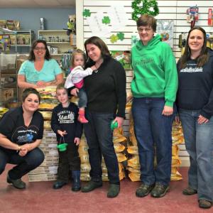 The huge stack of food donated to Underhound Railroad and LCAS. Back row, from left: Director Renee Coombs of Underhound, Annie Martin, Owner of the Animal House Aubrey Martin, Manager of LCAS Betsy Pratt, Officer Manager of LCAS of Carrie Koskela, bottom row: Vanessa Reed-Chapman, jack-of-all-trades for Underhound, and Ryan Martin. KATRINA CLARK/Boothbay Register