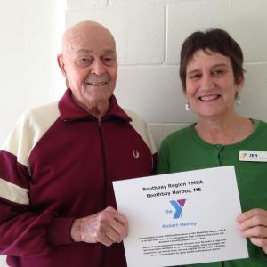 Robert Hanley is recognized as a Dorothy Abbott Senior Star by Jen Dorwart. Courtesy of Carrie Eason/Boothbay Region Y