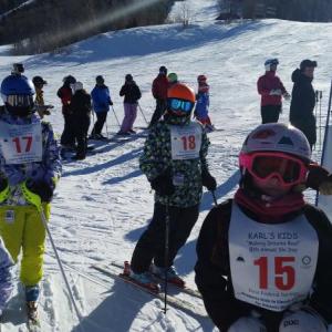 Participants in the Karl’s Kids fundraiser line up for a day of skiing at Sugarloaf. Courtesy of Karl’s Kids