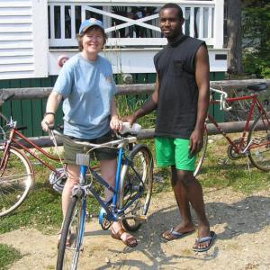 Rotarian Marty Helman issues a bike to international worker, Ricardo. Courtesy of Marty Helman