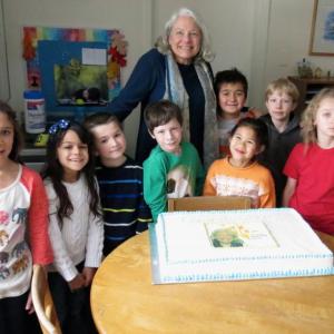 Nancie Atwell with students at the Center for Teaching and Learning in Edgecomb, with a cake celebrated her recent naming as a finalist for the award she went on to win on March 15 in Dubai. Courtesy of Kamala Grohman Nancie Atwell