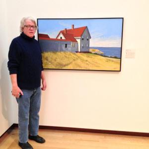 Kevin Beers stands beside his painting “Lightkeeper’s House, Monhegan” at the New Britain Museum of American Art in New Britain, Connecticut. Courtesy of Gleason Fine Art Kevin Beers