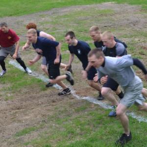 In 2014, the first heat of runners cross the starting line. Shawn St. Cyr, of Jefferson, is at the far left in a red shirt. He ran three laps, up and down Ragged Mountain, in total, 15K, including all of the obstacles of the annual Run For Your Life Emergency Service Challenge. (Photo by Lynda Clancy)