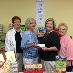 Pictured from left are Carole Zalucky, president of St. Andrews Auxiliary, Carol Lingard, treasurer of St. Andrews Auxiliary, Mary Patch and Nancy Van Dyke from Food for Thought. Courtesy of Leigh Sherrill
