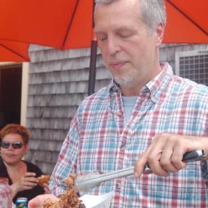 Sumner Richards serves pulled pork at Fernald’s Country Store on Saturday, June 27. ART MAYERS/Wiscasset Newspaper