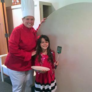Chef Abbie Shaw and hungry Sophia Scott roll out a table for St. Columba’s Blueberry Pancake Breakfast. Saturday, Aug. 8. will be the church’s 10th annual Blueberry Festival. Courtesy of Cherie Scott