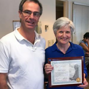 Gregory Wing Volunteer Holly Fulmer is the first recipient of The Andrews Award, named in honor of John F. Andrews, MD, who served the Boothbay area for more than 40 years. Fulmer is pictured with LincolnHealth Board Chairman Jeff Curtis, who presented the award. Courtesy of Alan Crowell