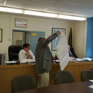 County Administrator John O’Connell (foreground) shows DOT plans to county commissioners. JANE CARPENTER/Wiscasset Newspaper