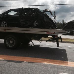 A Blagden’s wrecker travels Route 1 in Wiscasset on Aug. 9 with a car involved in an accident that backed up Route 1 traffic. SUSAN JOHNS/Wiscasset Newspaper
