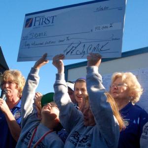 Special Olympians hold high a check for $40,000. ART MAYERS/Boothbay Register