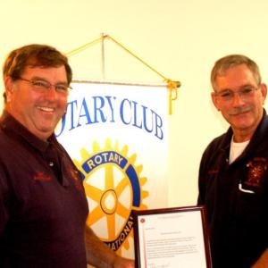 Assistant Fire Chief Gary Arsenault, left, receives Rotary Hometown Heroes award from Fire Chief Richard Spofford. ART MAYERS/Boothbay Register