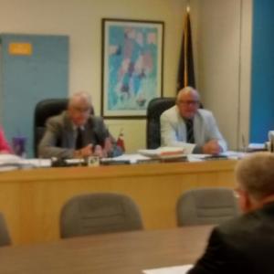 Lincoln County Sheriff Todd Brackett (back to camera) proposes bail program at county commissioners meeting. JANE CARPENTER/Boothbay Register
