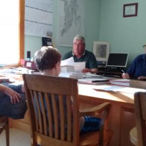 School board Vice Chairman Adam Harkins, left, Harrison Hinckley, second from left, and Finn Harkins, right, meet with Southport selectmen Gerry Gamage, Mary Lou Koskela and Smith Climo (not pictured). JANE CARPENTER/Boothbay Register