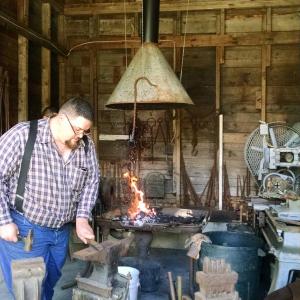 Master blacksmith Sam Smith at work at the Boothbay Railway Village. Courtesy photo