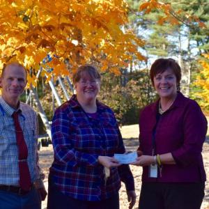 Mark Gorey and Nancy Rose present a check to Principal Lisa Clarke, on behalf of the Boothbay Region Education Association. These funds will be used to help the school and community build a new gazebo for the Edgecomb Eddy School Playground. Courtesy photo