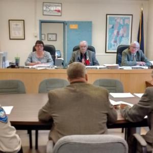 Lincoln County Sheriff Todd Brackett (back to camera, second from left) explains roles of law enforcement agencies to commissioners. JANE CARPENTER/Boothbay Register