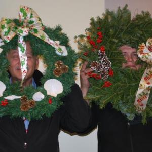 Doug Begin, left, and Gary Lawyerson show off their good fortune as drawing winners at the Christmas luncheon hosted by the St. Andrews Auxiliary for all employees of St. Andrews Village and the St Andrews Campus of LincolnHealth. Cheri Brewer, not pictured, won the centerpiece from the Village. Courtesy of Ann Kelley/St. Andrews Auxiliary