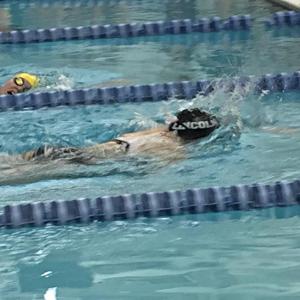 Seahawk Emma Pearce and Eagle Essie Martin both give it their all during the girls 200-yard freestyle, and both qualified for states. When they saw their scores they hugged, then cheered on their fellow swimmer, Annie Farnsworth. KATRINA CLARK/Boothbay Register