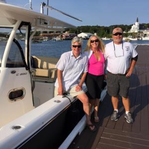 Tom Richardson, left, with Parker Kelley and a crew member at Brown’s Wharf in September. Courtesy of Parker Kelley