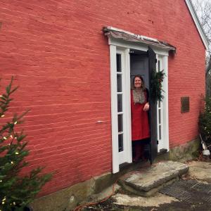 Susie Stephenson stands in the doorway of her new business, Stephenson Fiber Arts, on River Road in Edgecomb. SUZI THAYER/Boothbay Register